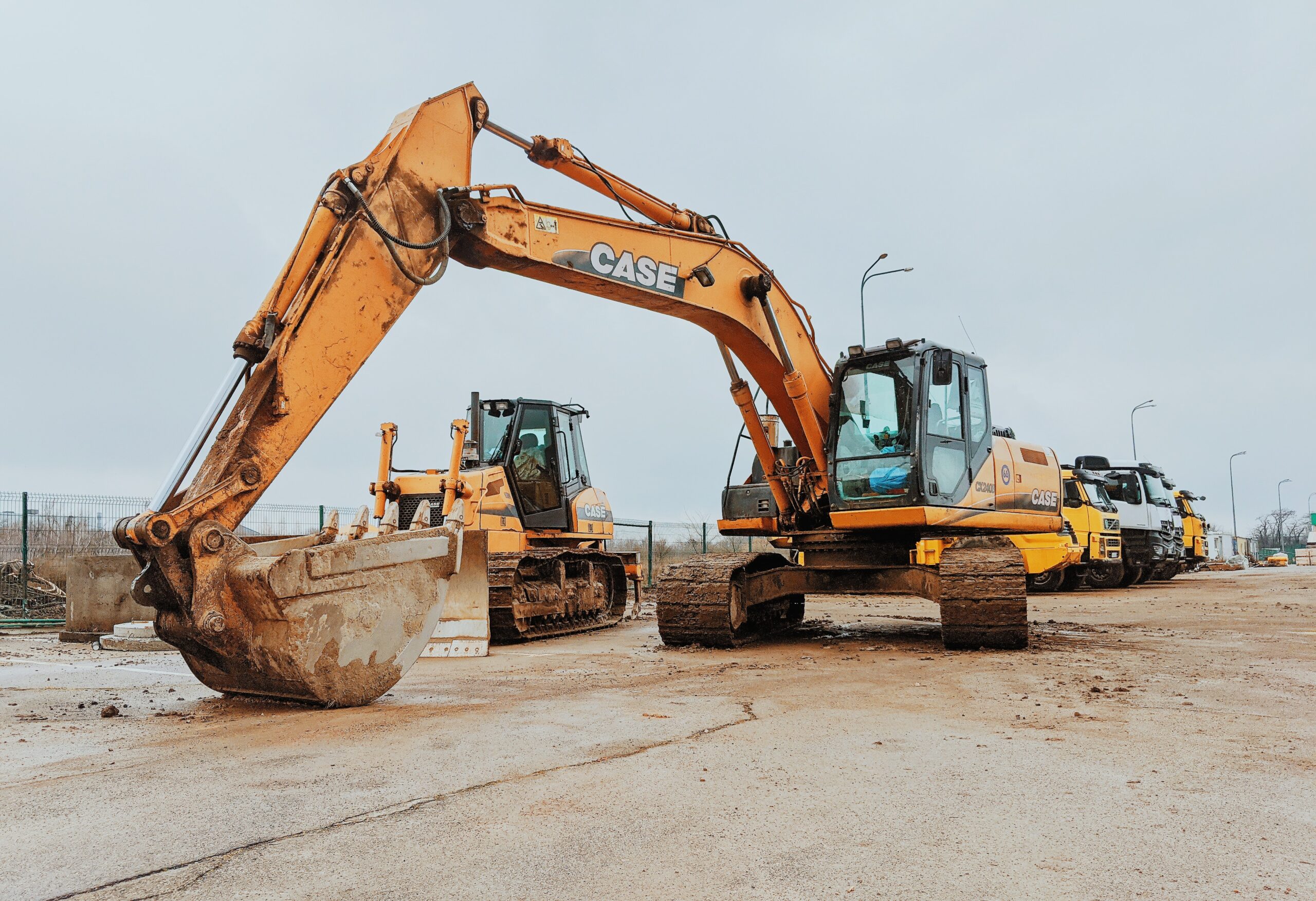 Excavator and large digging equipment on a roadway.